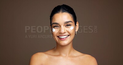 Buy stock photo Beauty, portrait and woman with face cream in studio for collagen treatment, hydration and self care. Mockup, person and happy with cosmetics product on brown background for skin glow and moisturizer