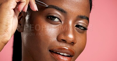 Buy stock photo Tweezer, eyebrow and portrait of black woman in studio for hair removal, grooming and self care. Beauty maintenance, growth and shaping with female person on pink background for tools and face