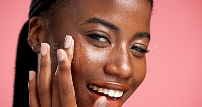 Buy stock photo Skincare, portrait or girl with oil in studio for face glow, hyaluronic acid or skin regeneration. Happy, black woman or apply beauty serum on pink background for natural shine, hydration or collagen