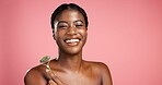 Black woman, portrait and skincare with jade roller in studio for facial on a pink background. Happy, female person or model with smile or beauty tool for face massage or anti aging on mockup space