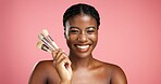 Portrait, black woman and brushes for makeup in studio background, beauty makeover and glamour. Happy, female person and cosmetic tools for transformation, foundation application and aesthetics flow