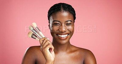 Buy stock photo Portrait, black woman and brushes for makeup in studio background, beauty makeover and glamour. Happy, female person and cosmetic tools for transformation, foundation application and aesthetic