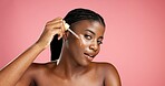 Portrait, facial treatment and black woman with serum, healthy skin and cosmetics for glow or shine. Mockup space, person and oil with anti aging benefits, studio background and pride for beauty