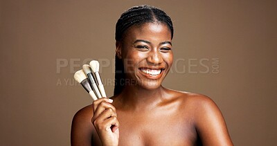 Buy stock photo Portrait, beauty and woman with brush for makeup, happy or tool for facial application or confident. Studio background, self care and black person with equipment for foundation, smile or mockup space