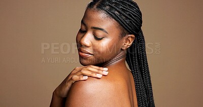 Buy stock photo Black woman, shoulder and studio with skincare for hygiene or dermatology on a brown background. Female person, model or touch with smile, texture or smooth skin for glow or shine on mockup space