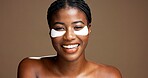 Woman, portrait and eye mask for skincare in studio, dermatology or reduce puffiness on background. Beauty, black person and hyaluronic patches for hydration or cosmetic product for dark circles