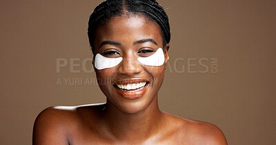 Buy stock photo Woman, portrait and eye mask for skincare in studio, dermatology or reduce puffiness on background. Beauty, black person and hyaluronic patches for hydration or cosmetic product for dark circles