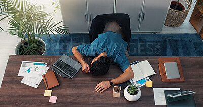Buy stock photo Burnout, sleeping and tired with man on desk in office for deadline on demographics project. Documents, fatigue and laptop with overworked business person lying on wooden table at work from above