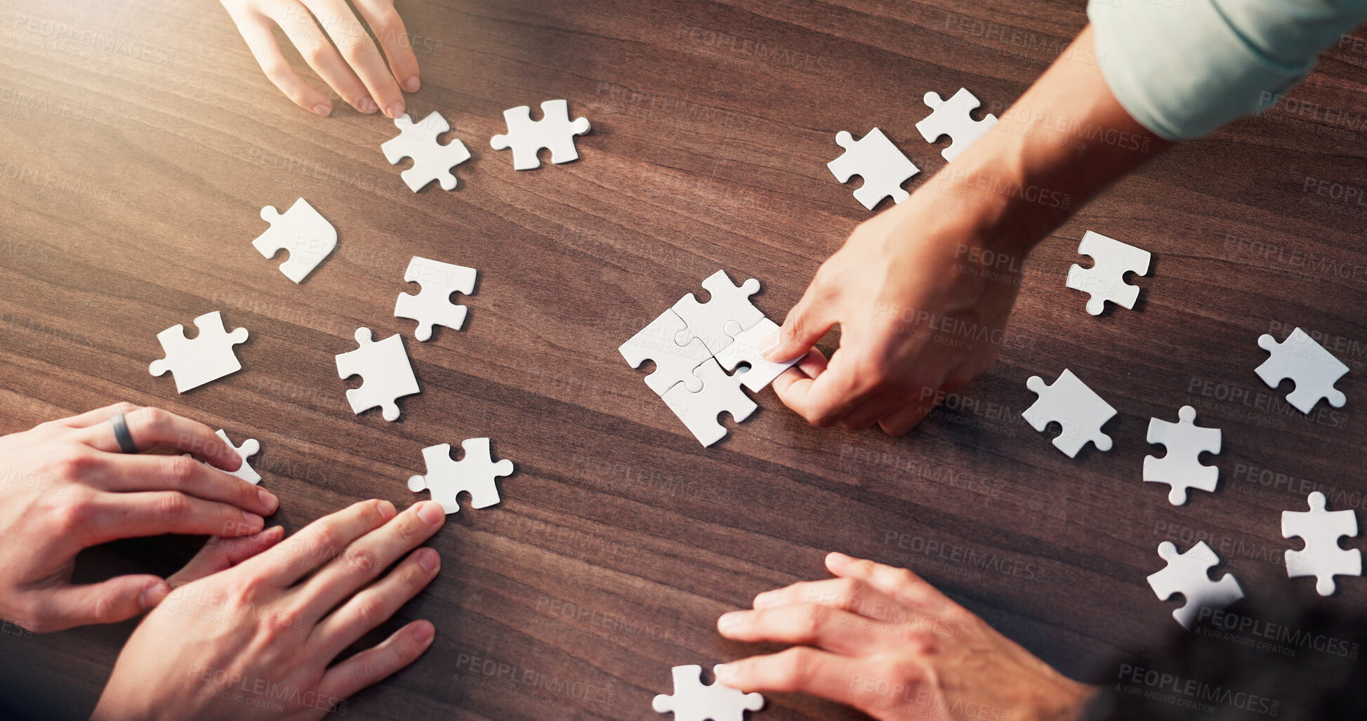 Buy stock photo Puzzle, collaboration and hands of business people in office with synergy, teamwork or unity. Problem solving, planning and group of corporate employees with jigsaw for cooperation from above.