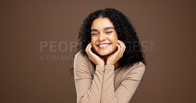 Buy stock photo Beauty, smile and hands with woman in studio for natural makeup, glow and self care. Happiness, shine and aesthetic with female person on brown background space for dermatology and hydration