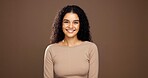 Natural, happy and portrait of woman in studio for beauty, curly hairstyle and healthy texture. Hair care, mockup space and person with shine for treatment, growth and cosmetics on brown background