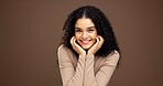 Glow, smile and hands with portrait of woman in studio for natural makeup, beauty and self care. Happiness, shine and aesthetic with person on brown background space for dermatology and hydration