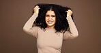 Mistake, hair and portrait of woman in studio with frizz problem, dry texture and damage. Hairdresser, salon and person worried for haircare treatment, curly routine and grooming on brown background