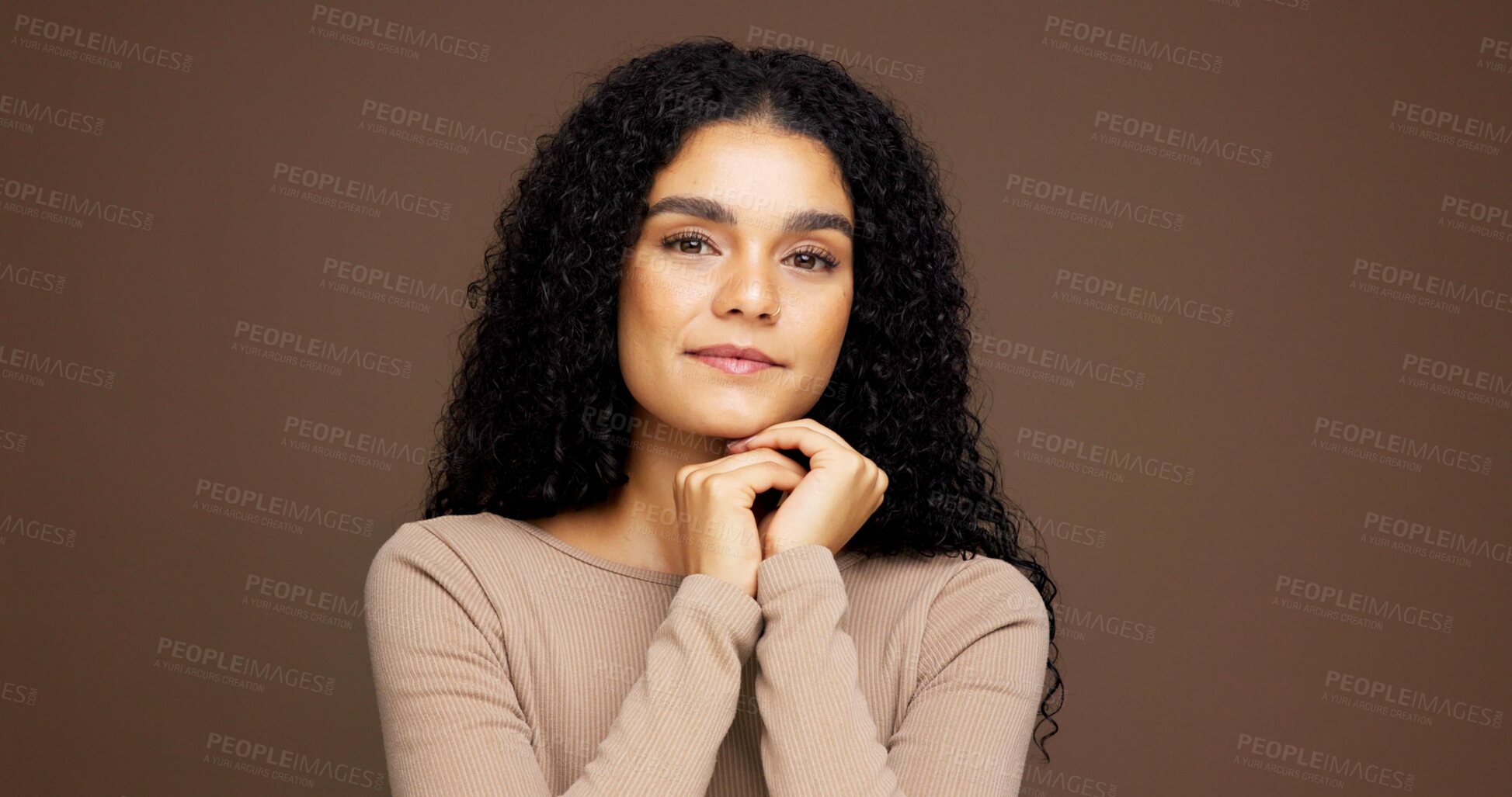 Buy stock photo Makeup, portrait and woman in studio for cosmetics, beauty or facial glow with glamour. Smile, natural and female person from Colombia with face cosmetology for confidence by brown background.