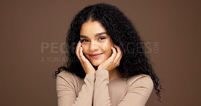 Buy stock photo Cosmetology, portrait and woman in studio for beauty, makeup or facial glow with happiness. Smile, natural and female person from Colombia with face cosmetics for confidence by brown background.
