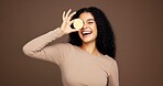 Portrait, woman and lemon for skincare in studio for vitamin c, brighten skin and natural detox. Female person, citrus and fruit for organic benefits, beauty and exfoliate results on brown background