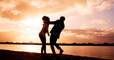 Buy stock photo Love, sunset and laugh with couple at lake for travel vacation, adventure and bonding. Support, environment explore and holiday with man and woman in nature for romance, anniversary and tourism