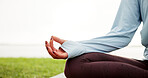Woman, hands and grass field with meditation for zen, spiritual healing or mindfulness by river. Female person, yoga or wellness with inner peace for tranquility, chakra or mudra on space in rain