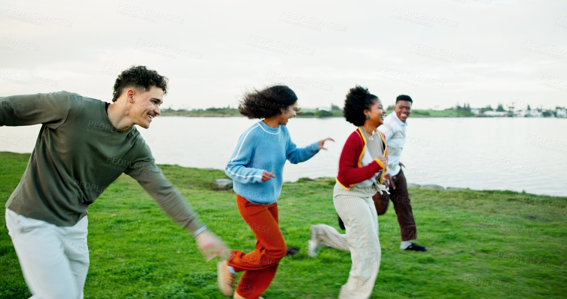 Buy stock photo Holiday, friends and running outdoor at lake for bonding, excited students and adventure together. Man, woman and group race on vacation for travel, journey and happy with energy on gap year by park