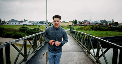 Buy stock photo Running, bridge and man in city for fitness, marathon training and workout for challenge. Sports, runner and person for wellness, performance and health in winter for endurance, cardio and exercise