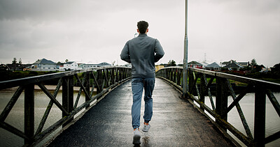 Buy stock photo Running, back and man on bridge for exercise, marathon training and workout for challenge. Sports, runner and person for wellness, performance and health in winter for endurance, cardio and fitness