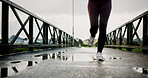 Workout, legs and athlete running on bridge for pace training, winter exercise or resilience. Fitness, shoes or person with cardio outdoor for endurance challenge, marathon competition or performance