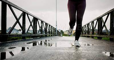 Buy stock photo Workout, legs and athlete running on bridge for pace training, winter exercise or resilience. Fitness, shoes or person with cardio outdoor for endurance challenge, marathon competition or performance