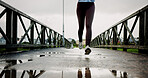 Fitness, legs and athlete running on bridge for speed training, winter exercise and resilience. Workout, shoes and woman with cardio outdoor for endurance, marathon competition and healthy activity