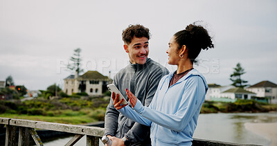 Buy stock photo Exercise, break and couple with phone on bridge for fitness app, discussion and workout performance. Runners, teamwork and people with smartphone in nature for cardio progress and track running speed