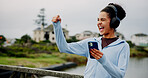 Success, fitness or excited woman in city with phone for workout, exercise goals or song. Lake, cheering or athlete runner on mobile app for running progress, music playlist and winning challenge
