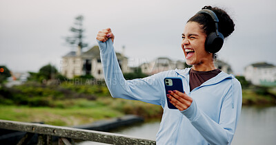 Buy stock photo Success, fitness or excited woman in city with phone for workout, exercise goals or song. Lake, cheering or athlete runner on mobile app for running progress, music playlist and winning challenge