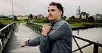 Exercise, stretching and thinking with man on bridge for start of morning cardio routine. Fitness, getting ready and warm up with athlete outdoor in nature park for running, training or workout