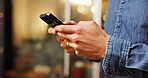 Phone, hands and man in coffee shop with networking, communication or connectivity in mobile app. Cellphone, texting and male person on blog for restaurant review on website in restaurant or diner.