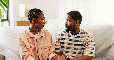 Buy stock photo Black couple, sofa or discussion with boxes in new home for relocation, fresh start or support. African man, woman or owners with commitment in trust or care on couch for apartment, property or house