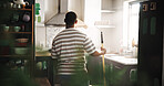 DIY, paint roller and thinking with black man in kitchen of new house for maintenance from back. Decision, painting and real estate with homeowner person in apartment for development or renovation