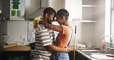 Buy stock photo Renovation, dance and black couple hug in home for love, remodeling or bonding together with care. Painting, happy man and woman with music in kitchen to celebrate house upgrade, romance and embrace