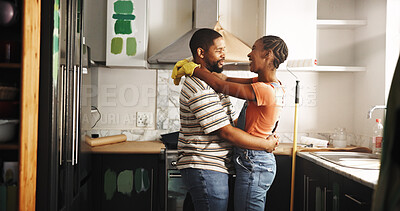 Buy stock photo Painting, dance and happy couple in home for love, remodeling and bonding together with care. Renovation, man and African woman with music in kitchen to celebrate house upgrade, romance and embrace