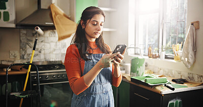 Buy stock photo DIY, phone and renovation with woman in kitchen of apartment to search for home improvement ideas. App, communication and maintenance with person in new house for interior design or online planning