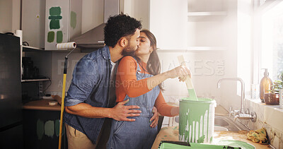 Buy stock photo Couple, kiss and painting kitchen at new house for renovation, interior design and decoration. People, love and romance with paint brush of DIY improvement, remodeling upgrade and repairs maintenance