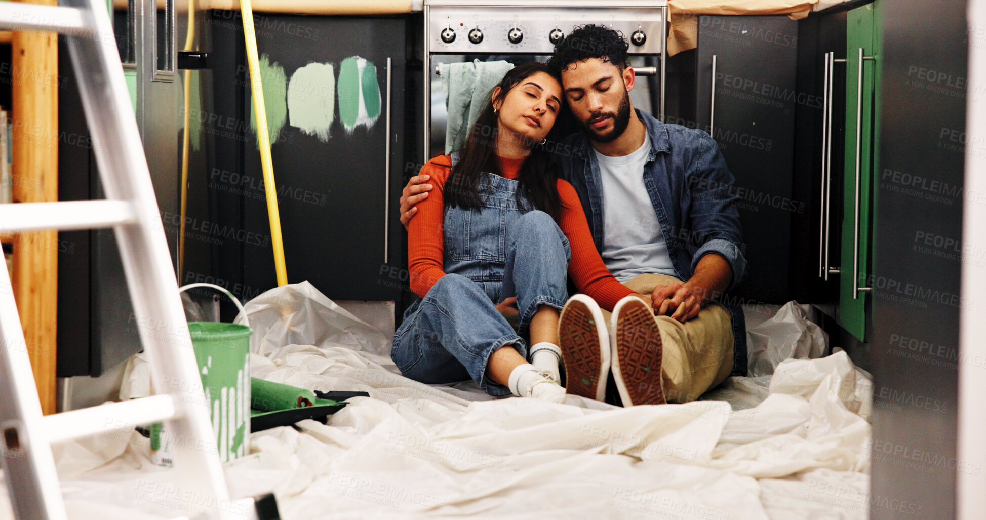 Buy stock photo Paint, renovation or tired couple sleeping in kitchen for home upgrade, diy makeover or hug. Interior design, people or holding hands with nap on floor for remodeling break, maintenance and rest