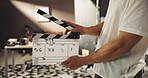 Person, hands and studio production with clapperboard for action, take or rolling scene on set. Producer, director or camera assistant with movie slate, cut or edit for film making, play or reel
