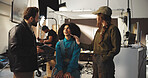 Director, actress and makeup artist with production crew for instructions or preparation on set. People, producer and team getting ready with cast for character, role play or film making in studio