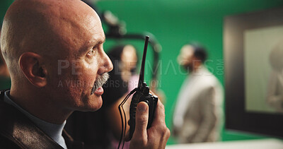 Buy stock photo Man, director and radio with green screen for action, scene or instruction in production studio. Male person, producer or manager talking with signal or cut for take, cue or special effects in set