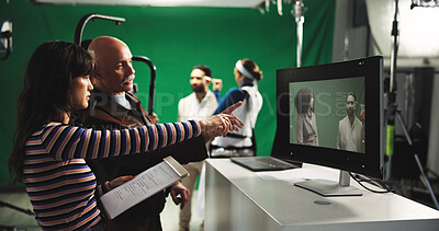 Buy stock photo Man, director and producer with green screen for scene playback, action or recording in studio. Manager, woman or pointing to monitor with production crew for preview, film making or cut in set