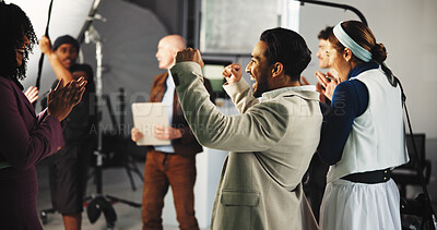 Buy stock photo Happy people, crew and winning with production for film making success, teamwork or good job on set. Excited, group or cast with fist pump or applause for done or completion in recording studio