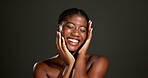 Beauty, glow and smile with hands of black woman in studio for skincare, smooth texture and dermatology. Hygiene, aesthetic and shine with person on dark background space for hydration and body care