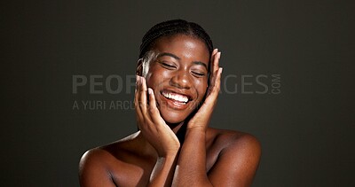 Buy stock photo Beauty, glow and smile with hands of black woman in studio for skincare, smooth texture and dermatology. Hygiene, aesthetic and shine with person on dark background space for hydration and body care