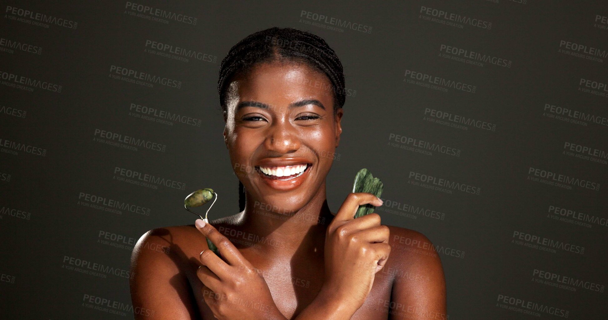 Buy stock photo Gua sha, beauty and portrait of black woman in studio for smooth skin, facial and lymphatic drainage. Space, dark background and person with jade roller for health, skincare treatment and dermatology