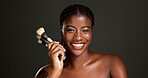 Studio, happy and woman with makeup brush, portrait and equipment for beauty, makeover and selfcare. Gray background, black person and cosmetic for self expression, creative and tools for foundation