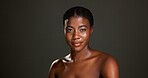 Beauty, portrait and woman for skincare in studio with hydration mist, glowing face and confidence. Mockup, black girl and smile with damp skin from glycerin treatment and toner on black background